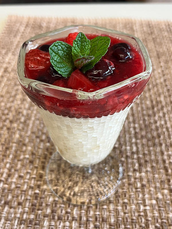 millet vanilla pudding with berry compote and mint
